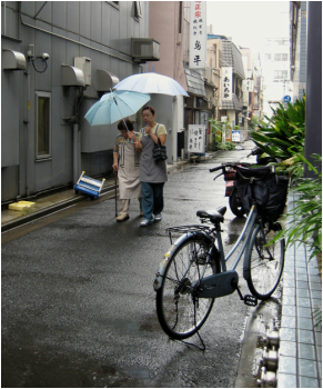 Two ladies walking in the rain